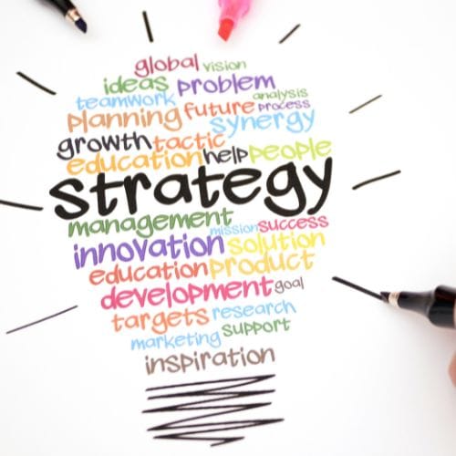 17 A lightbulb shape formed by colorful words like strategy, innovation, growth, and education on a white background.