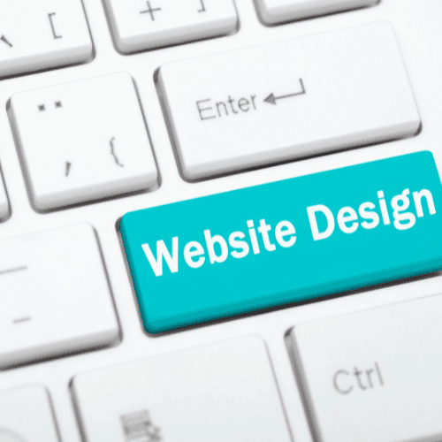 A computer keyboard with a turquoise key labeled Website Design in place of the Enter key.