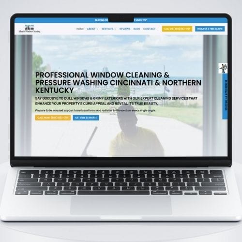 Alberts Window Cleaning Portfolio PC A laptop displays a website for professional window cleaning and pressure washing services in Cincinnati and Northern Kentucky.